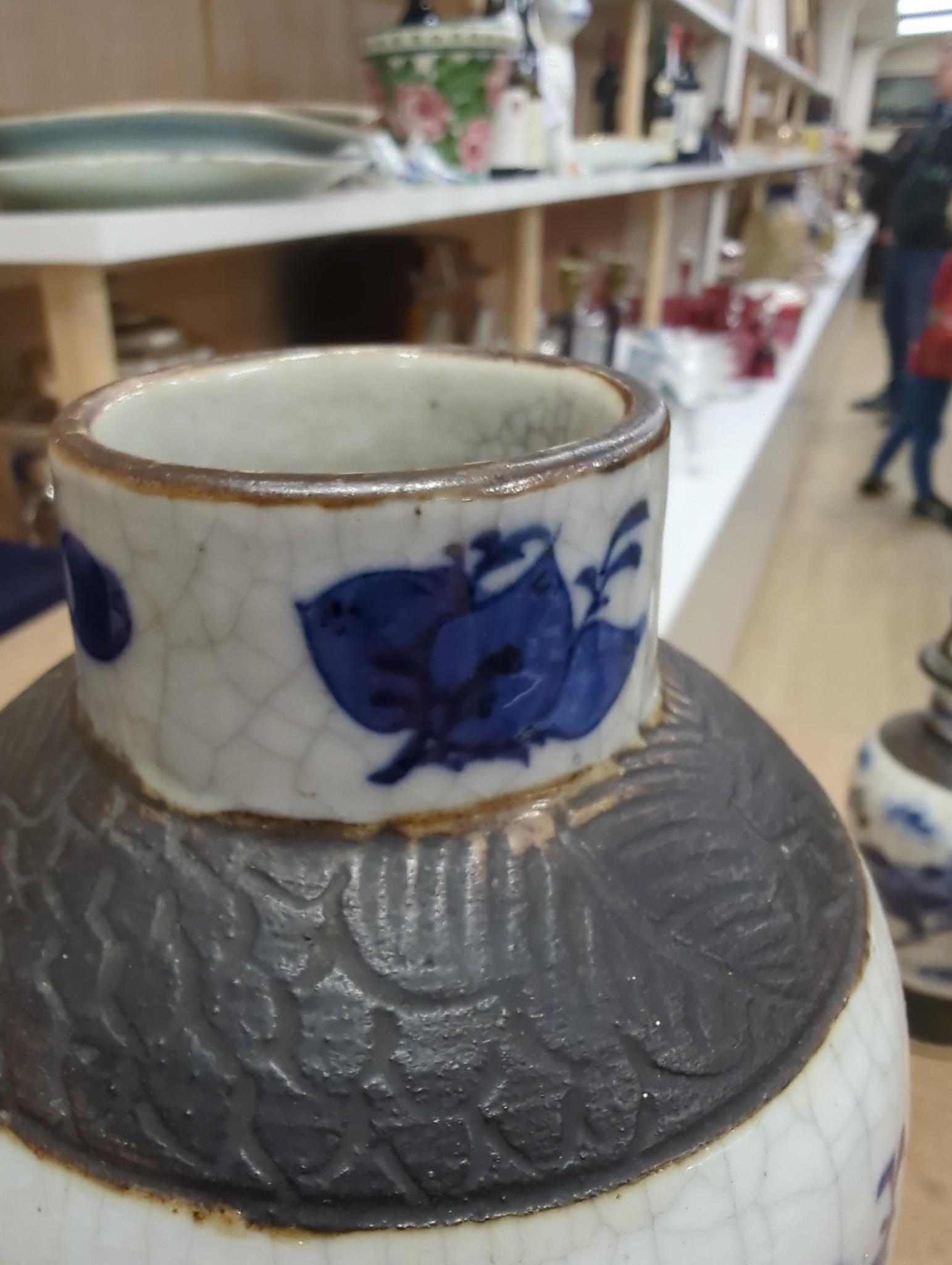 Three Chinese blue and white crackle glaze vases, a famille rose brush pot, late 19th/early 20th century, a crackle glaze ginger jar and a carved soapstone lion-dog (6)